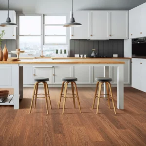 Mohawk Laminate in a rich reddish-brown wood color in a kitchen | Broadway Carpet & Flooring