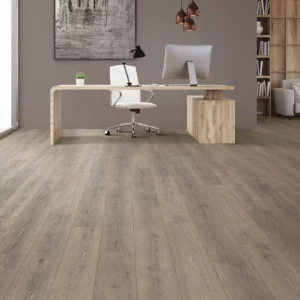 Mohawk Laminate in a gray-brown wood tone in a home office | Broadway Carpet & Flooring