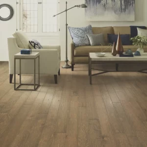 Light brown hardwood in a living room featuring | Broadway Carpet & Flooring