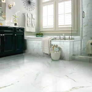 Shaw Floors Calacatta Oro polished white marble-look tile in a luxurious bathroom | Broadway Carpet & Flooring