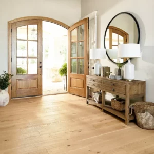 Shaw Floors light hardwood in an entryway with large wooden double doorsy | Broadway Carpet & Flooring