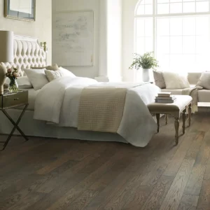 Shaw Floors medium brown Hardwood in a bedroom | Broadway Carpet & Flooring