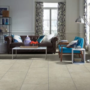 Shaw Floors tile in a light beige cafe color, in a living room | Broadway Carpet & Flooring