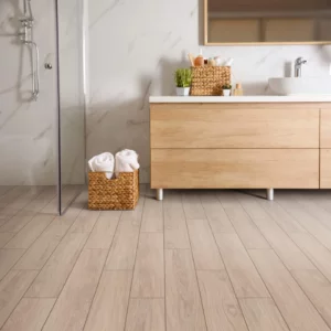 Shaw Floors tile with a light wood look, in a modern bathroom | Broadway Carpet & Flooring