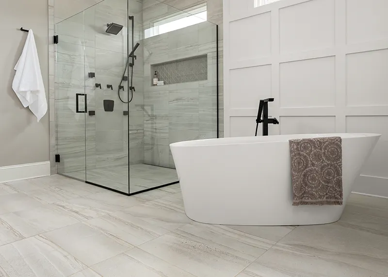 Shaw-Tile Tile flooring and walls in bathroom with shower and soaking tub